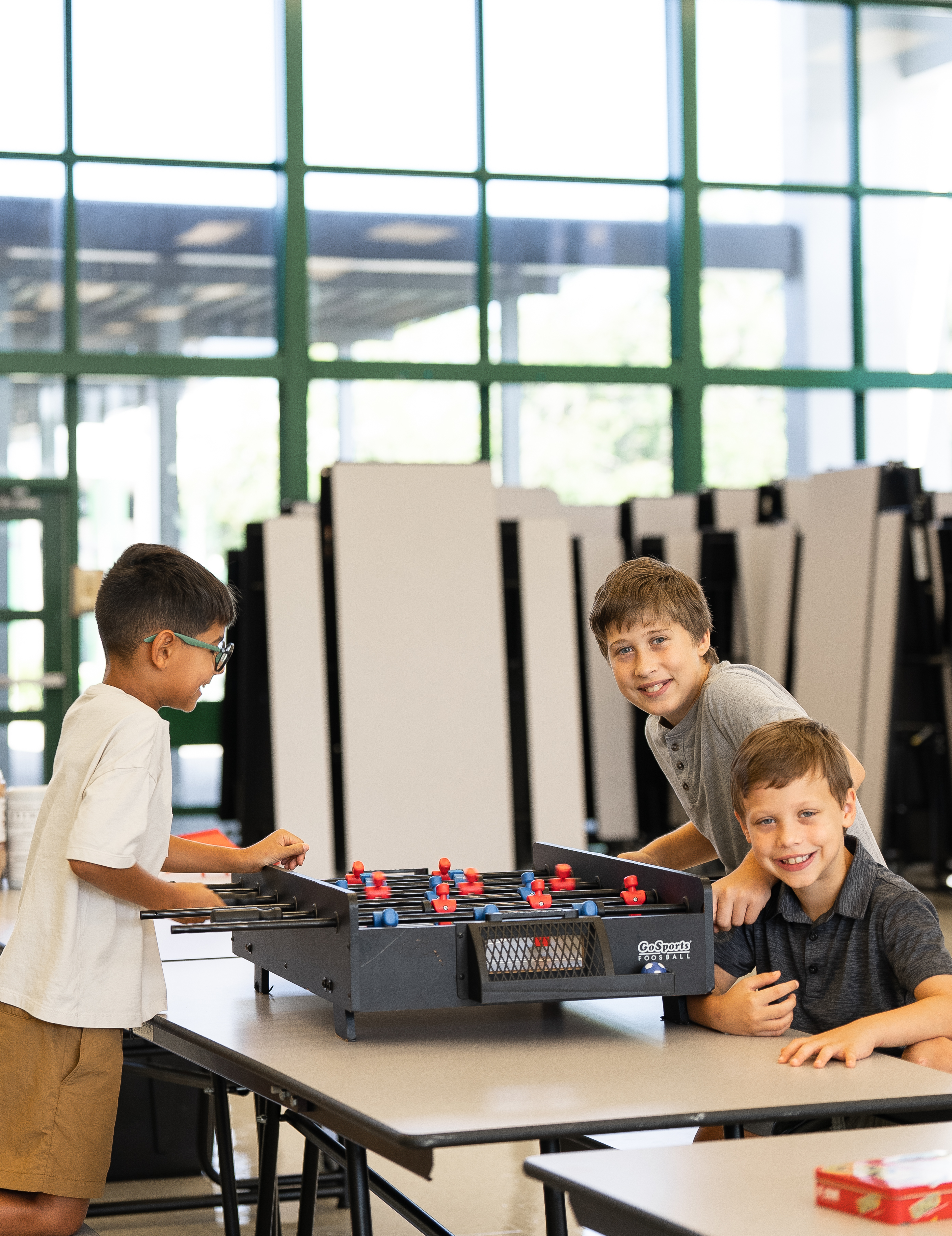 Boys playing foosball at Legacy Kids