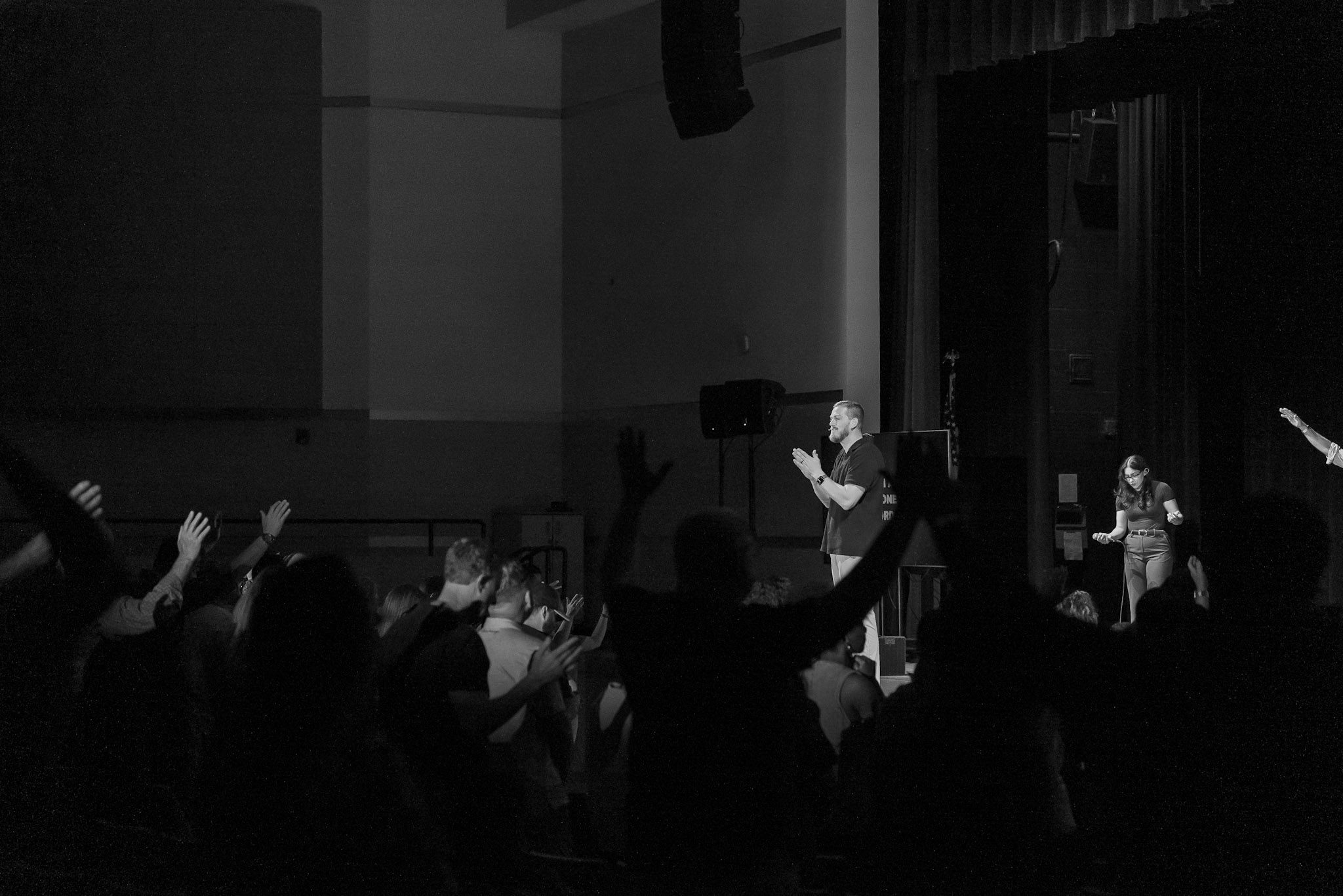 Pastors Chad and Jade worshipping with congregation